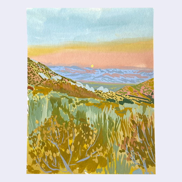 Colorful plein air painting of a canyon scene, with lots of brush in the foreground. The sky is a warm sunset, with blue leading to yellow and then a salmon pink. 