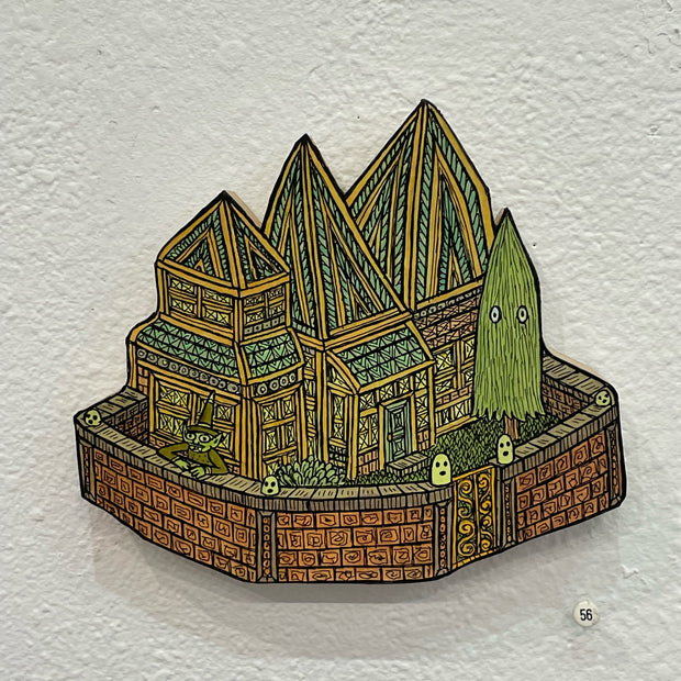 Illustrated wood cut of a greenhouse styled building with many pointed roofs. A small skinny pine tree stands in the yard with small eyes. A green goblin with a pointy hat stands behind the brick wall fencing in the house.
