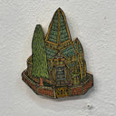 Illustrated wood cut of a smaller gothic style house with a tall skinny pine tree with eyes in the yard. A green goblin with a long tongue and very pointy hat stands near the brick fencing.