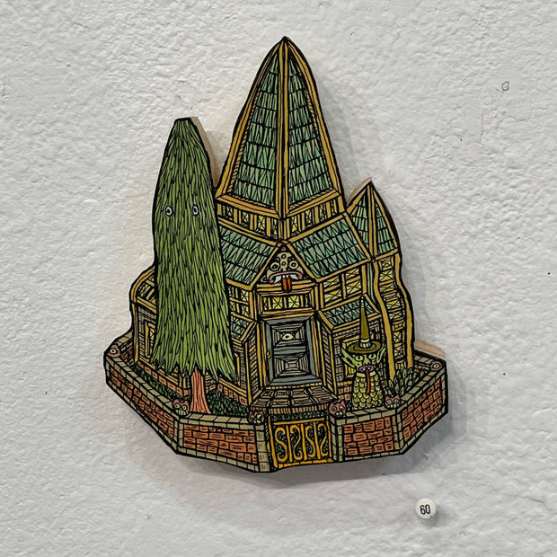 Illustrated wood cut of a smaller gothic style house with a tall skinny pine tree with eyes in the yard. A green goblin with a long tongue and very pointy hat stands near the brick fencing.