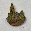 Illustrated wood cut of a geometric gothic style house with one pointy roof, a small goblin with a pointy hat stands in the yard behind a brick fence.