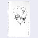Ink drawing on spiral bound sketchbook paper of a floating head, with a large conch style shell tied atop their head. A one eyed cat pin is on the side of the hat.