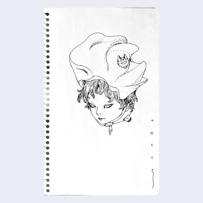 Ink drawing on spiral bound sketchbook paper of a floating head, with a large conch style shell tied atop their head. A one eyed cat pin is on the side of the hat.