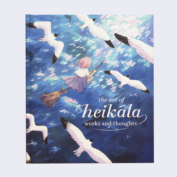Book cover, a full color illustration of a pink hair girl riding a broom over a shining ocean, with seagulls flying along side her. "The Art of Heikala Works and Thoughts" is written in stylized white font in bottom right.