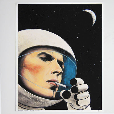 Finely shaded illustration of David Bowie's head and hand, smoking a cigarette while wearing a space suit and helmet. Background is black sky with stars and crescent moon.