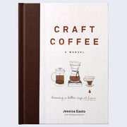 Book cover, all white with a thick brown spine coloring. 3 small illustrations of different coffee machines are under the title, which is in impressed copper font.