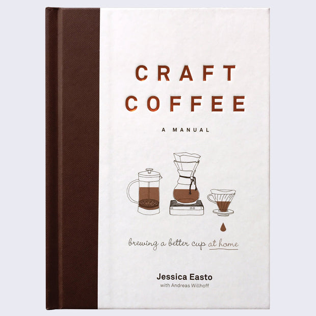 Book cover, all white with a thick brown spine coloring. 3 small illustrations of different coffee machines are under the title, which is in impressed copper font.
