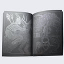 Open two page zine spread, silver ink comic panel of aliens fighting, accompanied by story text.
