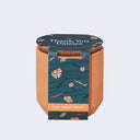 Small terracotta pot with packaging that reads "thank you daisies".