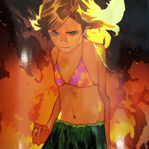 Close up of illustration of an angry looking girl, wearing a bathing suit top and grass skirt, with blonde hair that is being lit up by flames and smoke behind her. Her hand is balled into a fist.