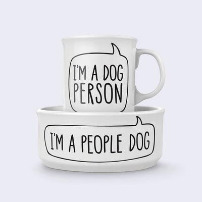 Matching white mug and dog bowl. The mug has plain text that reads "I'm A Dog Person" and the bowl reads "I'm A People Dog"