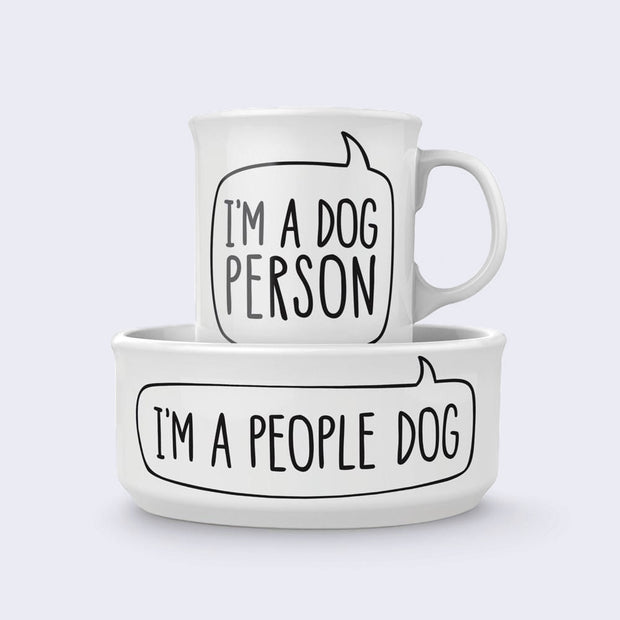 Matching white mug and dog bowl. The mug has plain text that reads "I'm A Dog Person" and the bowl reads "I'm A People Dog"