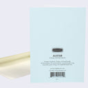The back of note card is shown with an envelope behind it. The back of notecard is blue with text that describes where and how it was printed.