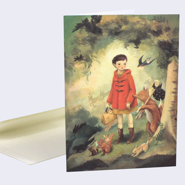 The front of note card is shown. The notecard has an illustration of a girl in a red coat. She is surrounded by animals who carry bindle sticks.