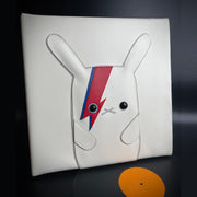 Vinyl (pleather) recreation of David Bowie's "Aladdin Sane" vinyl record cover, with a white bunny in the center instead of David Bowie. The bunny has lightning bolts of red and blue over its left eye. A pleather record peeps out from the album cover.