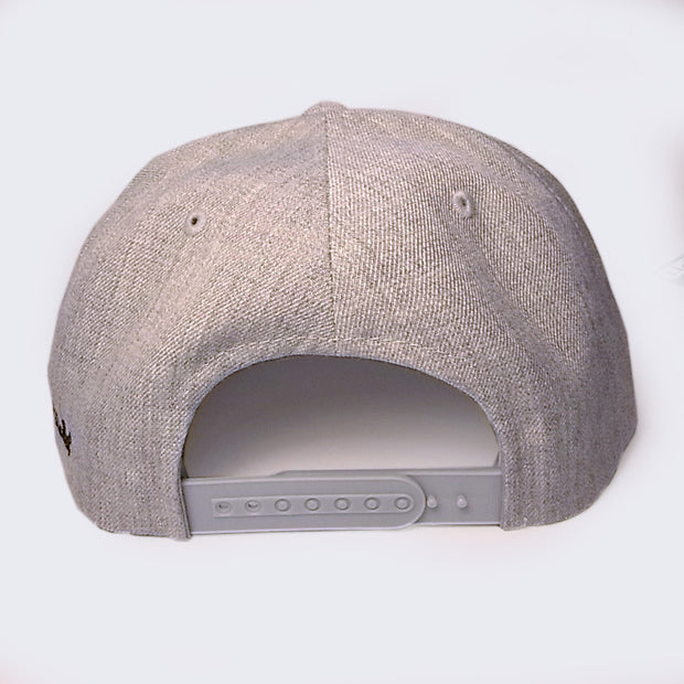 Back of grey hat, with a snap closure for size adjustment.