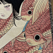 Close up detail photo of tapestry of a pink cheeked woman with long black hair, swimming amongst a densely packed group of orange koi fish.