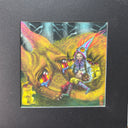 Colorful scene of a large fox like dog with large tearing eyes curled up. It has several puppies in its lap as well as a girl with long braids and a pointy hat. Piece is within a thick black frame.