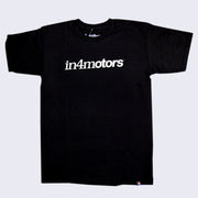 Front side of black t-shirt. White text across chest says in four motors.