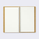 Open spread of spiral ring notebook, revealing white blank pages.