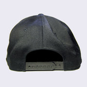 Back side of black baseball cap.