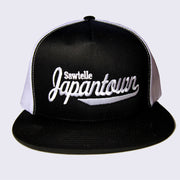 Black hat with a white mesh backing. Front of the hat has embroidered words that read "Sawtelle Japantown".