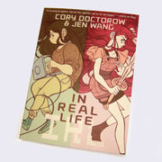 Book cover featuring an illustration of 2 girls, lying down back to back. Their hair intertwines. One is typing on a laptop and wearing muted clothes. The other is wielding a sword and dressed in all pink.
