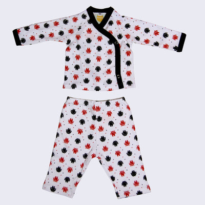 Long sleeved kimono top for babies and matching pants. Collar and cuffs are black. Matching pants have an elastic waist band.