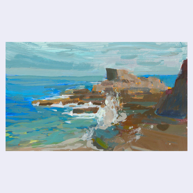 Plein air painting of beach scene with rock formations and waves crashing up onto them.