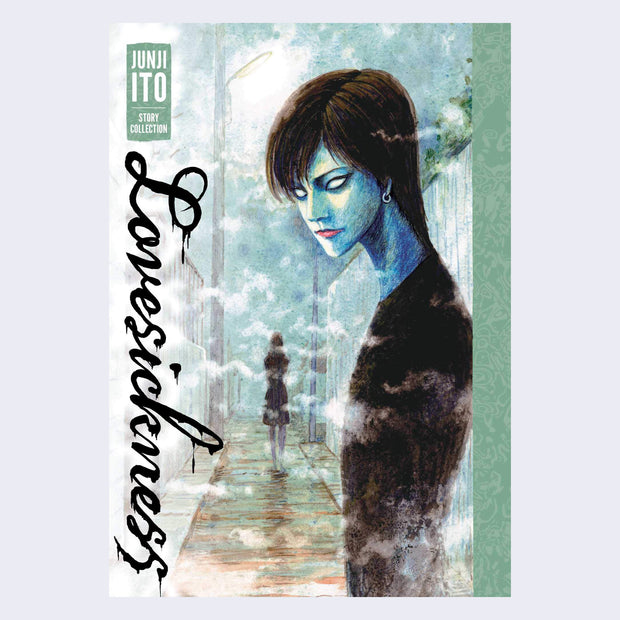 "Lovesickness" book cover, featuring an illustration of a blue faced person with all white eyes looking at the viewer, with a shadowy figure in the background. Title is written in dripping cursive, vertically along the left.