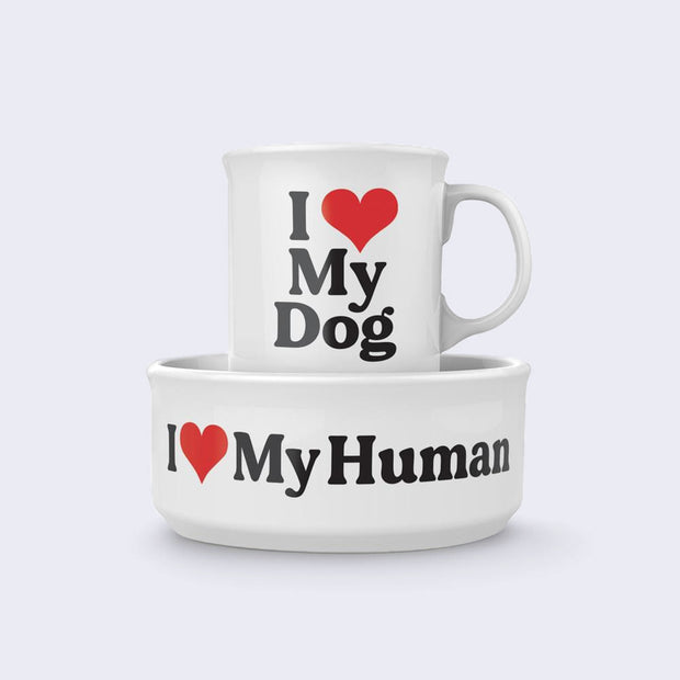Matching white mug and dog bowl. The mug has plain text that reads "I (Heart) My Dog" and the dog bowl has the same text and reads "I (heart) My Human."