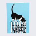 The front of note card is shown. The notecard has an illustration of a tuxedo cat on a fence poking at a vine with flowers.