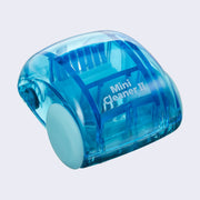 Blue plastic semi transparent dome shaped car, with small wheels and a brush mechanism inside, which turns with the wheels and rotates the bristles like a sweeper. Back reads "Mini Cleaner II"