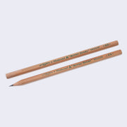 2 natural wood grain pencils with "Established 1887, Matured Mitsu-Bishi 9800 EW HB" written in green on side of pencil. One is sharpened and one is yet to be sharpened.