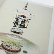 Detail photo of a book page, featuring an illustration of an abstractly designed Murakami character.