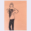 Charcoal portrait on tan paper of a woman standing with her hand on her hip and the other in position to hold a cigarette.