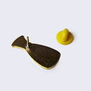 Back of enamel pin, with a yellow rubber pin backing.