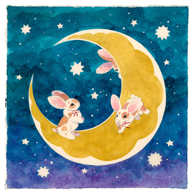 Watercolor painting of 3 white rabbits with brown spots, playing on a golden crescent moon, against a greenish blue to purplish blue ombre night sky with some white stars.