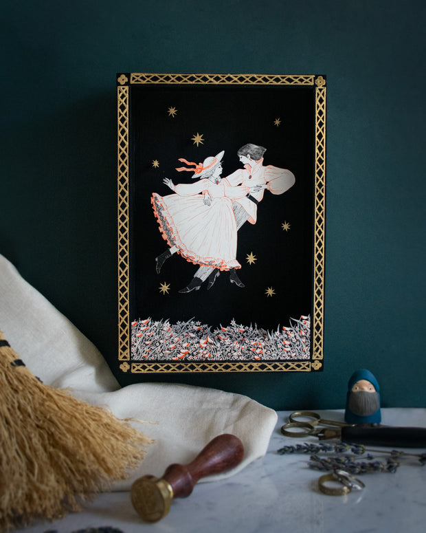 Shadowbox like illustration of a couple, dancing together over a bed of flowers. Illustration is done in very fine lines, orange and black on white paper. They are against an all black background with a gold pattern border and some gold stars floating.