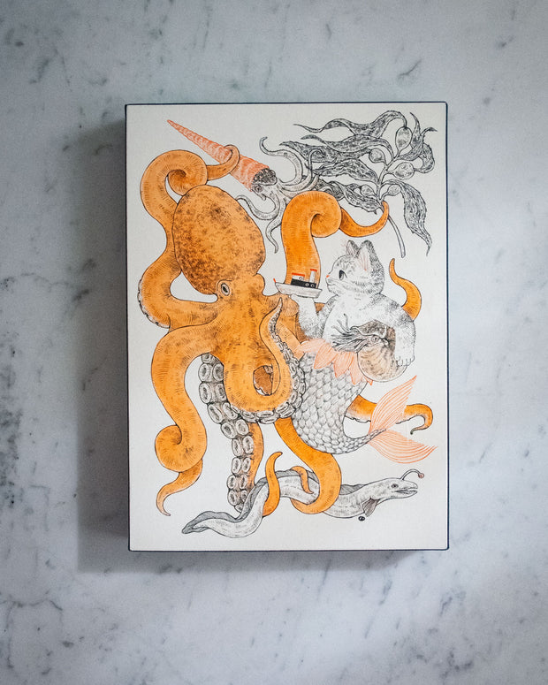 Ink drawing on white panel with orange accent coloring of a large octopus intertwined with a cat mermaid. The cat holds a small ship in one hand and a Nautilus under the other arm. A squid and an eel swim nearby with kelp.