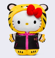 Plush of Hello Kitty, wearing a full body tiger costume, that goes over hear head like a hood, leaving her face revealed. She also wears a black satin style jacket with pink accents.