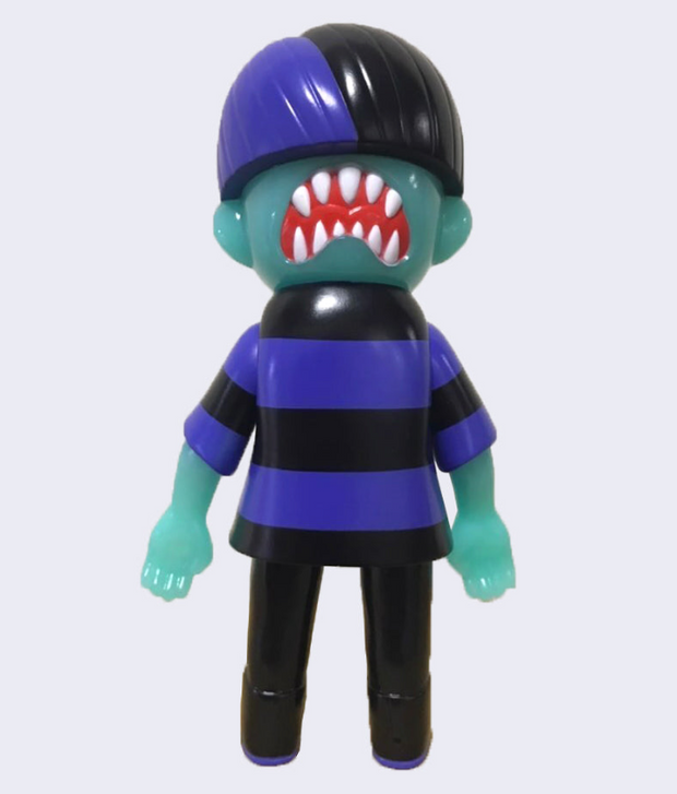 Back view of Vinyl figure of a green skin boy wearing a purple and black striped shirt, black pants and black sneakers with purple laces. Back of his head has a bright red downturned mouth with many sharp white teeth.