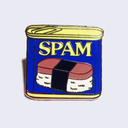 Die cut enamel pin of a can of Spam, with its traditional blue and gold product packaging.