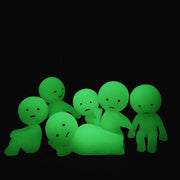 6 variations of Smiski, all glowing in the dark. Options include: sitting with hands on knees, laying on side with head in hand, sitting on a ledge, looking to the side with arms out, peeking around corner, or looking behind.