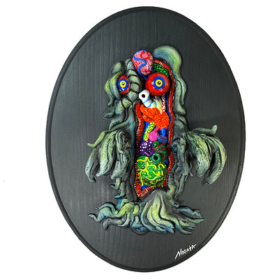 A 3D sculpture of Hedorah mounted on wood, similar to a scientific specimen. Half of Hedorah is exposed internally, with many colorful organs of all different shapes, patterns and textures. 