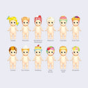 12 vinyl Kewpie babies, standing nude with different dessert themed hood hats. Options are: wrapped piece of candy, pancake, strawberry shortcake, popcorn, cupcake, fruit tart, cookie, ice cream, pudding, jelly beans, cream puff or konpeito.