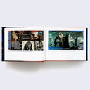 Open two page book spread of various Star Wars photographs and memorabilia.