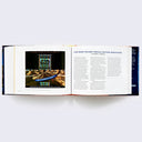 Open two page book spread of various Star Wars photographs and memorabilia and accompanying text.