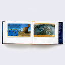 Open two page book spread of various Star Wars photographs and memorabilia.