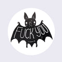 White circle sticker with a drawing of a cute cartoon bat. Large text stretches across its wings that says fuck you.